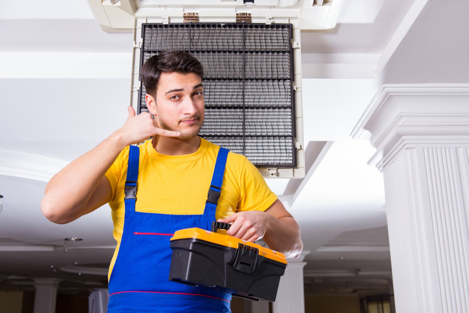 Man Repairing Air Conditioning Unit